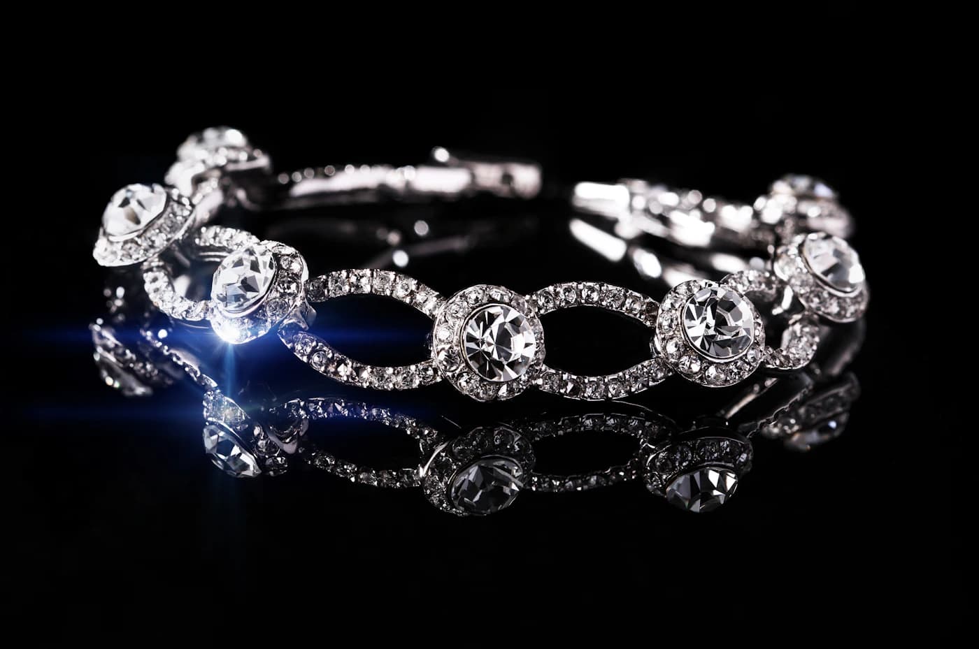 Diamond-set bracelet on a dark reflective surface