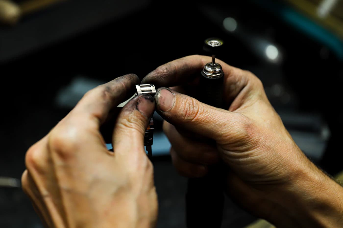 Jeweller repairing a piece with precision hand tools