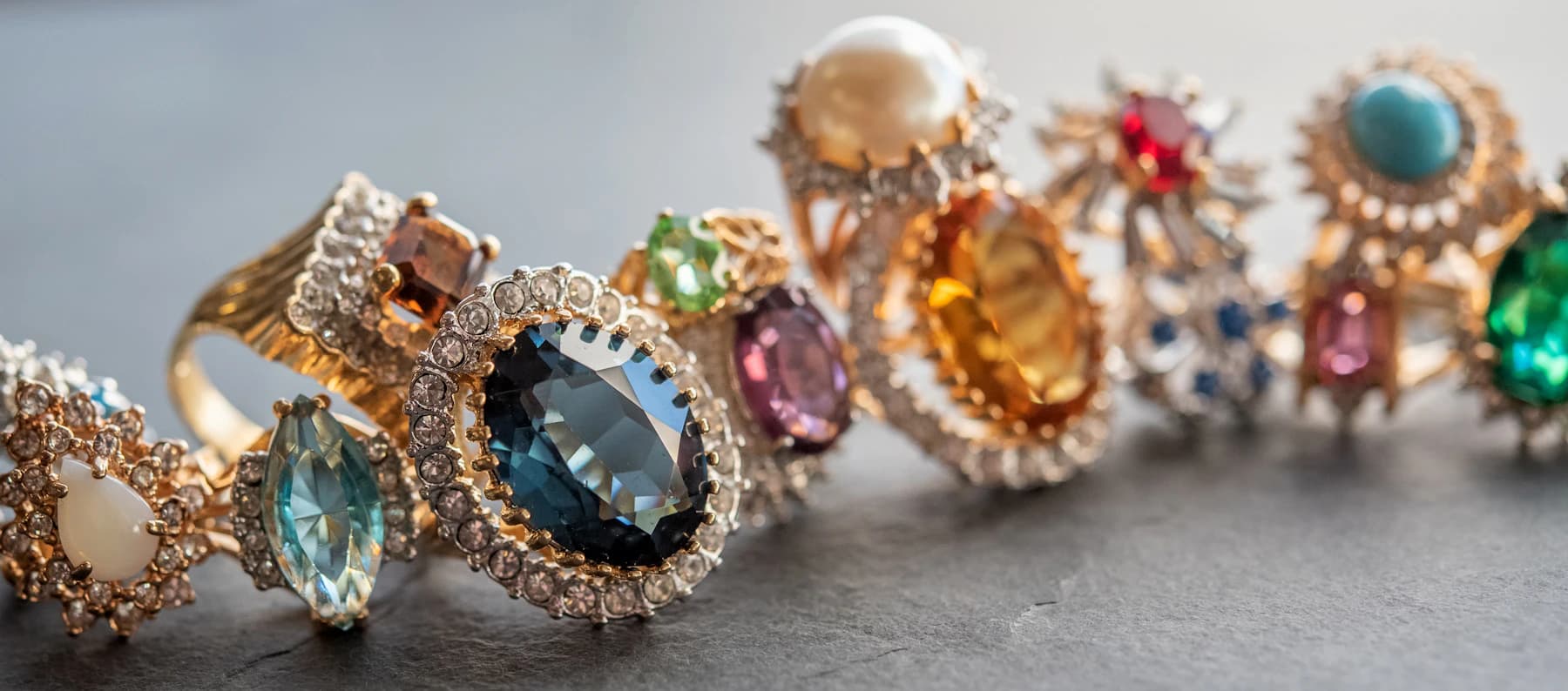 Assorted gemstone rings set with rubies, sapphires, and emeralds