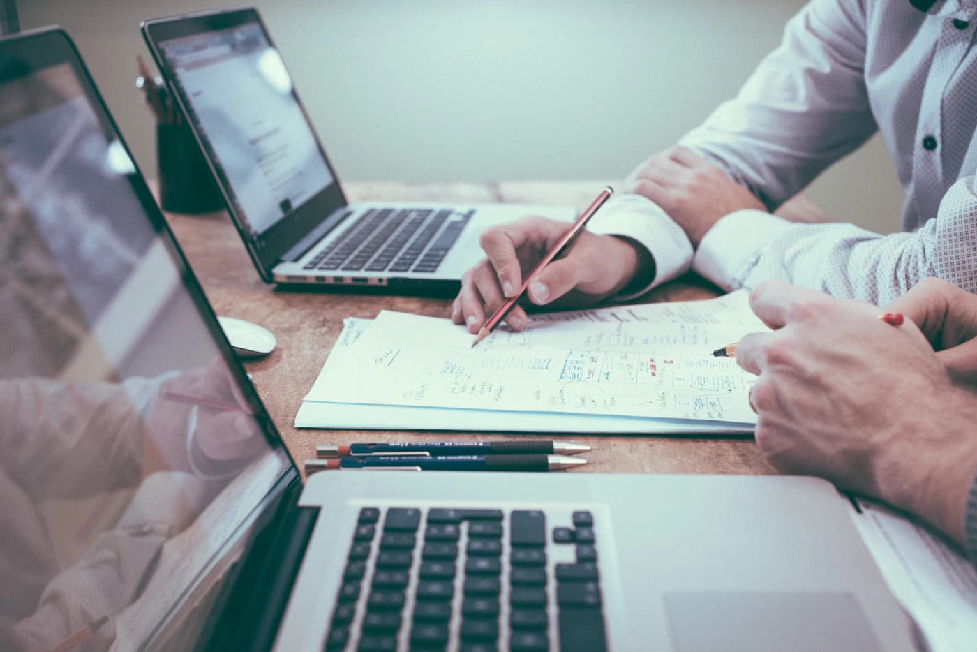 Advisors reviewing figures together at a desk