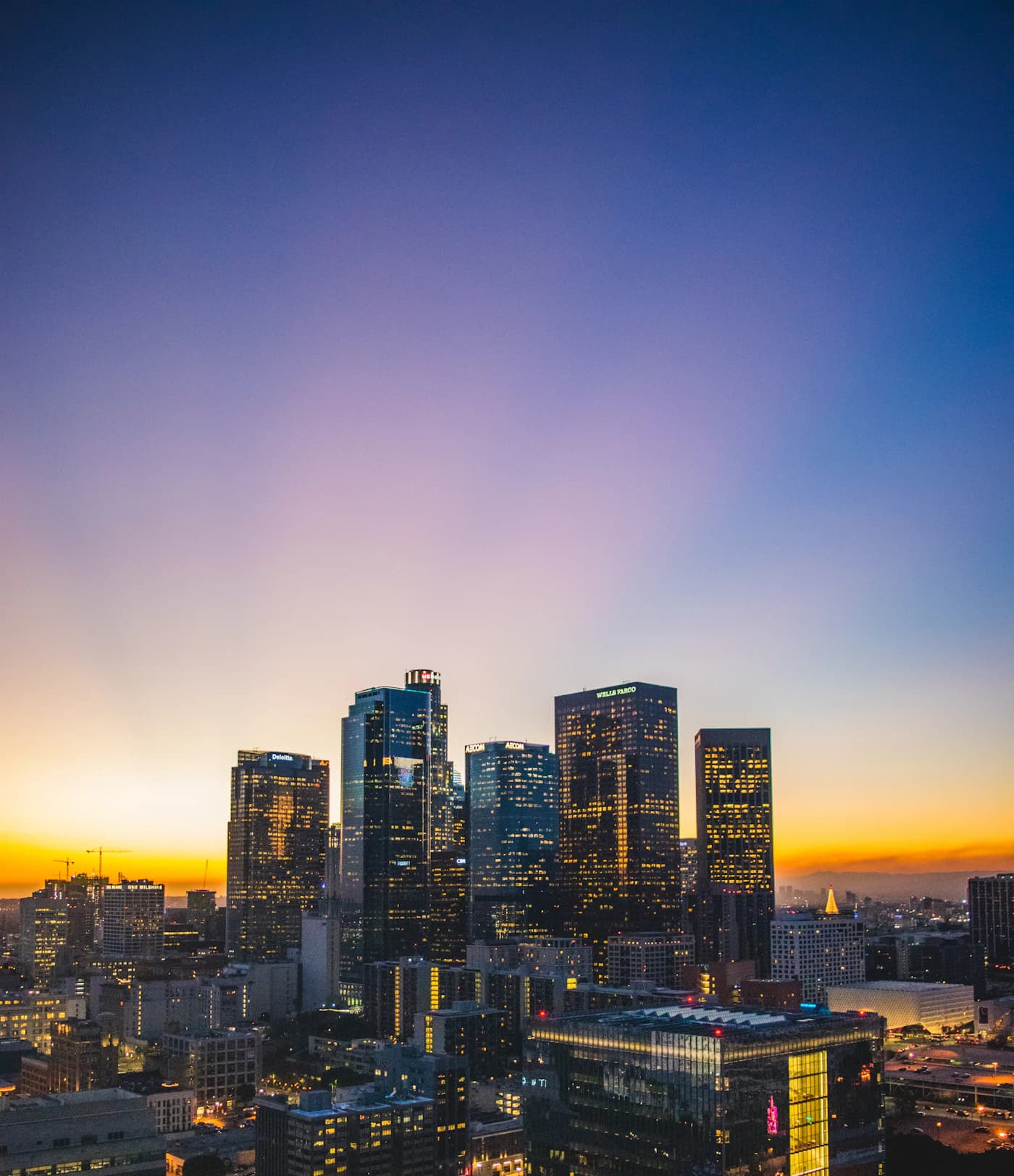 City financial skyline glowing at sunset